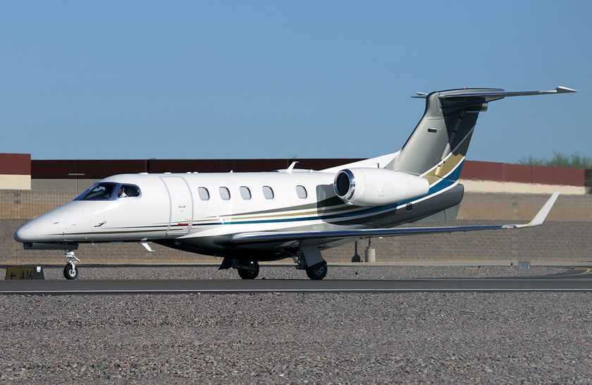 Embraer Phenom 300E private jet in flight