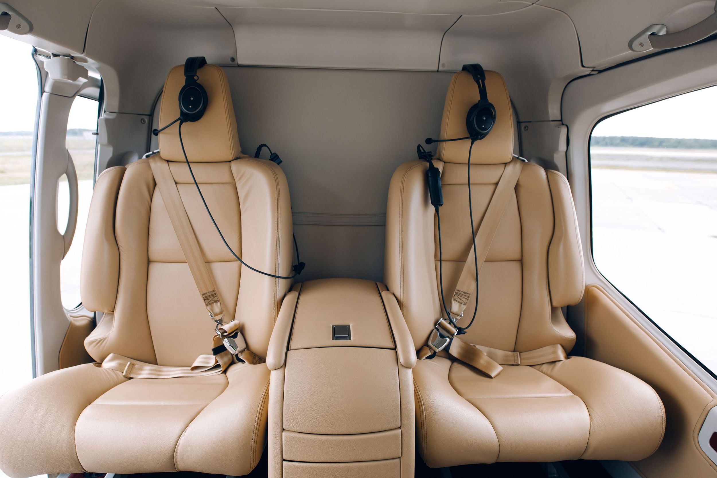 Inside the cream leather cabin of a private helicopter