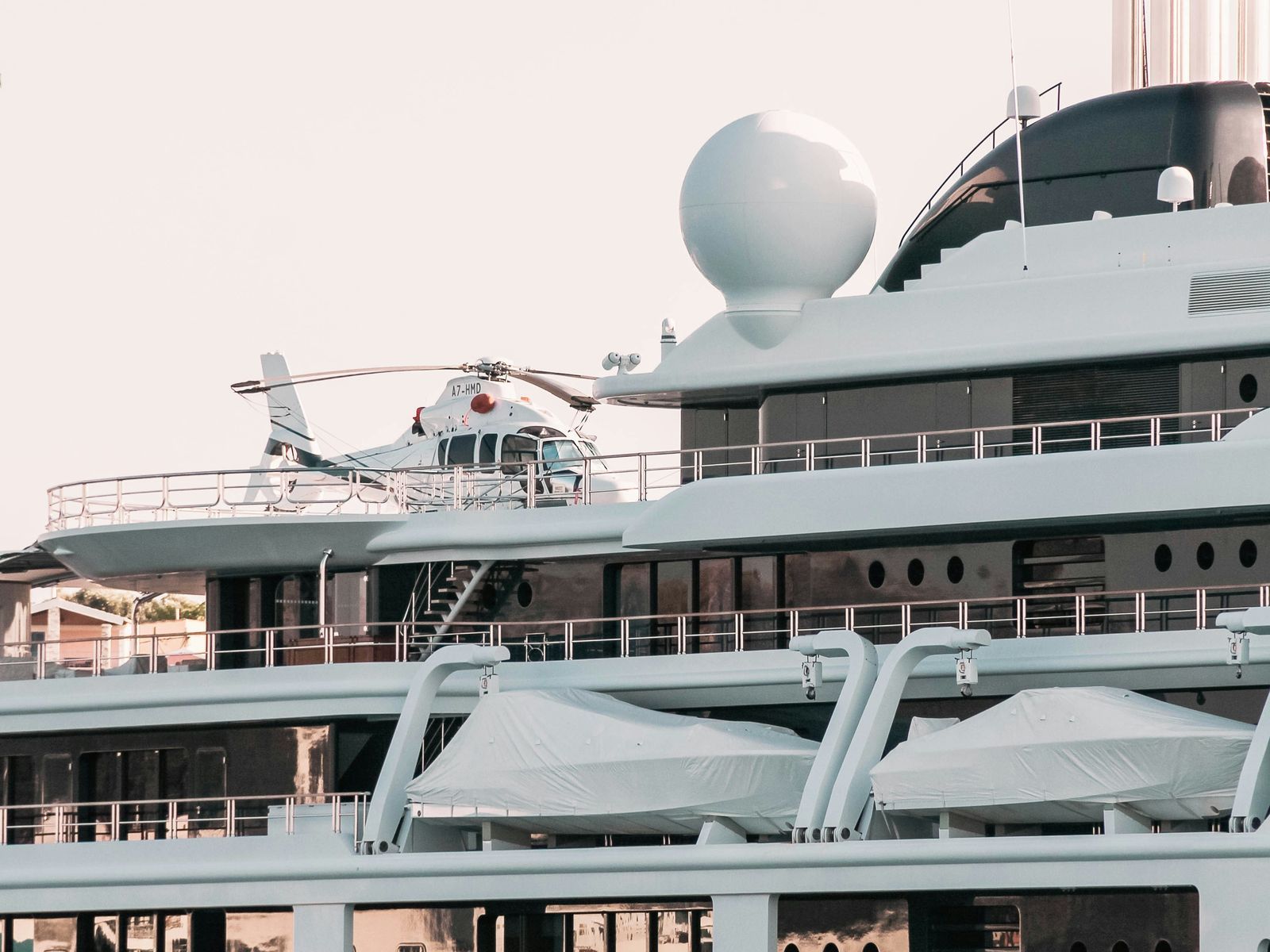 A helicopter on the helipad of a superyacht